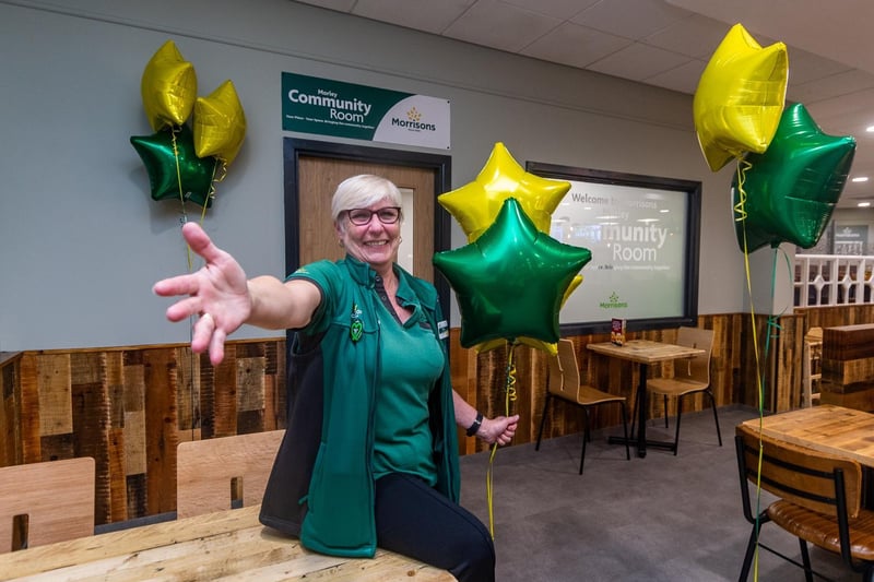 Tracey Reimers, community champion, next to the new Community Room within the cafeteria.

(photo: James Hardisty)