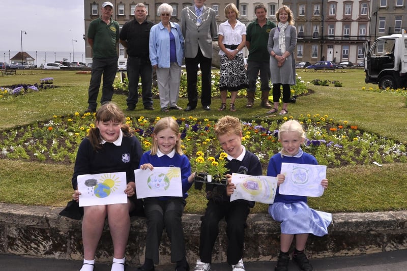 Young winners of the In Bloom flower bed competition.  









Students from Whitby Community College visit a roadshow for Engineering Week. 



Children of Ruswarp School are excited to be in the crowd to see the Queen at Scarborough.