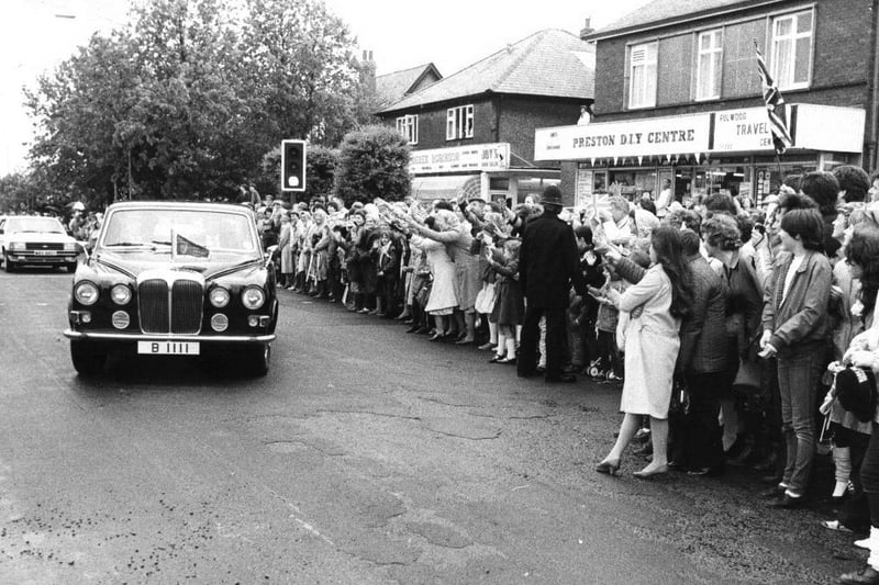 The Princess of Wales drives past the crowds in Garstang Road, Preston in
1983.