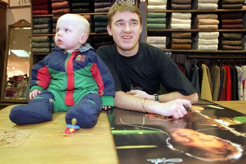 Snooker star Stephen Hendry was at the Sweater Shop in Wakefield to sign autographs and meet fans. Young James Cross seemed a little less than impressed with his birthday treat.