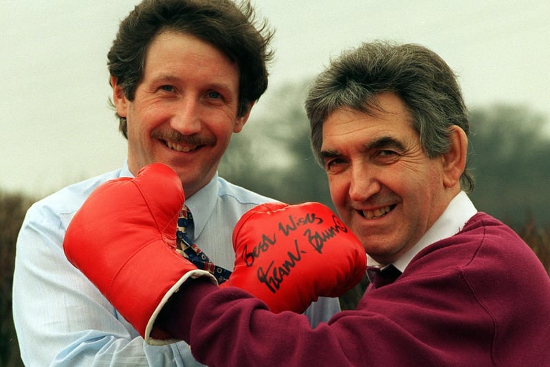 Michael Taylor (left) and Terry Rigg, community fundraiser for Wakefield Hospice with boxing gloves signed by Frank Bruno and Lennox Lewis.