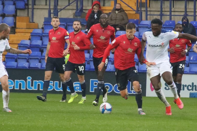 Liam McAlinden comes under pressure from the Tranmere defence