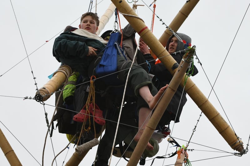 Animal Rebellion protesters suspended from a bamboo structure outside a McDonalds distribution site in Hemel Hempstead, Hertfordshire, which is being blockaded to stop lorries from leaving the depot.