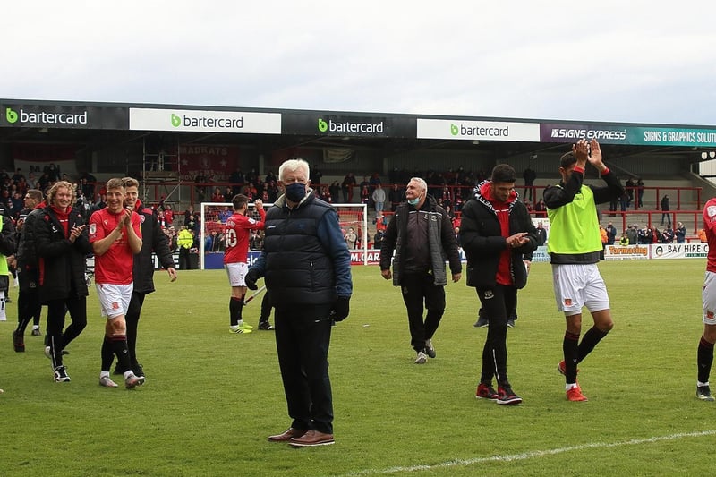 Morecambe's players applaud the fans at full-time