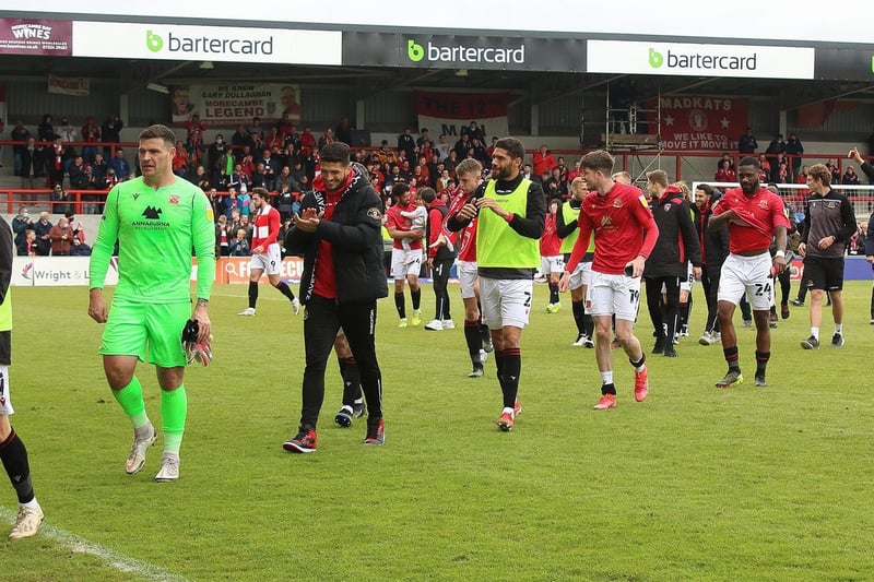 Morecambe's players head back to the dressing room after booking their place at Wembley