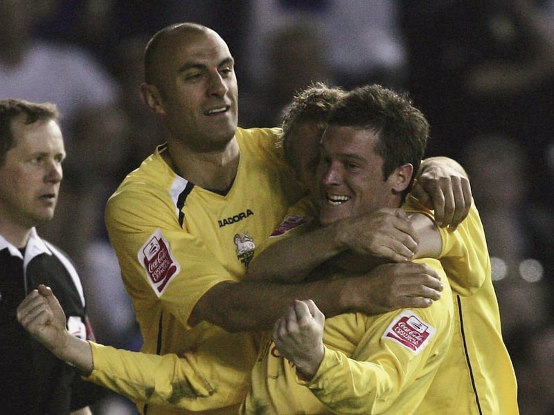 Preston North End striker David Nugent celebrates with Danny Dichio and Brett Ormerod after scoring the opening goal.
