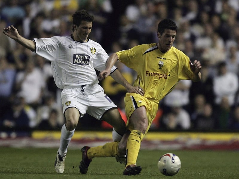 Preston North End's Brian O'Neil drives forward despite the attention of Liam Miller