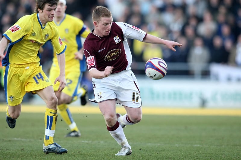 Jonny Howson closes in on Northampton Town's Jonathan Hayes during the  League One clash at the Sixfields Stadium in February 2008.