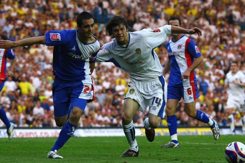Jonny Howson tussles with Carlisle United's Grant Smith during the League One play-off semi-final first leg at Elland Road in May 2008.
