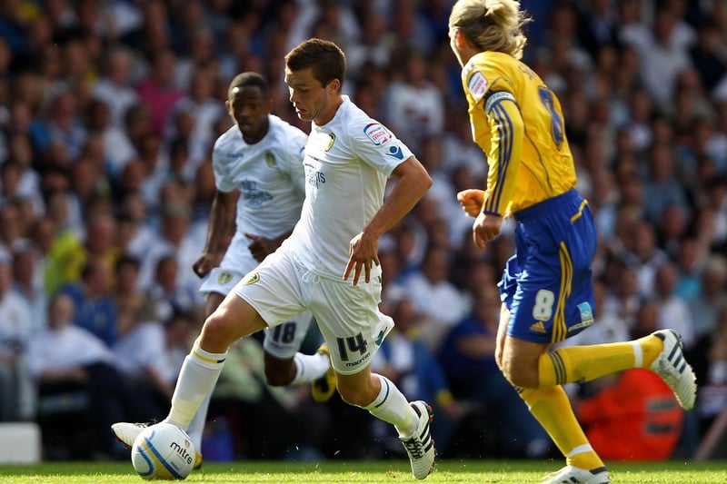 Jonny Howson moves away from Derby County's Robbie Savage during the Championship clash at Elland Road in August 2010.