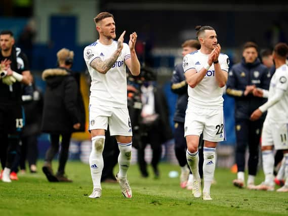 WHAT A YEAR: Club captain Liam Cooper, left, and Jack Harrison, right, applaud Leeds United's fans following Sunday's season finale victory against West Brom at Elland Road. Photo by Jon Super - Pool/Getty Images.