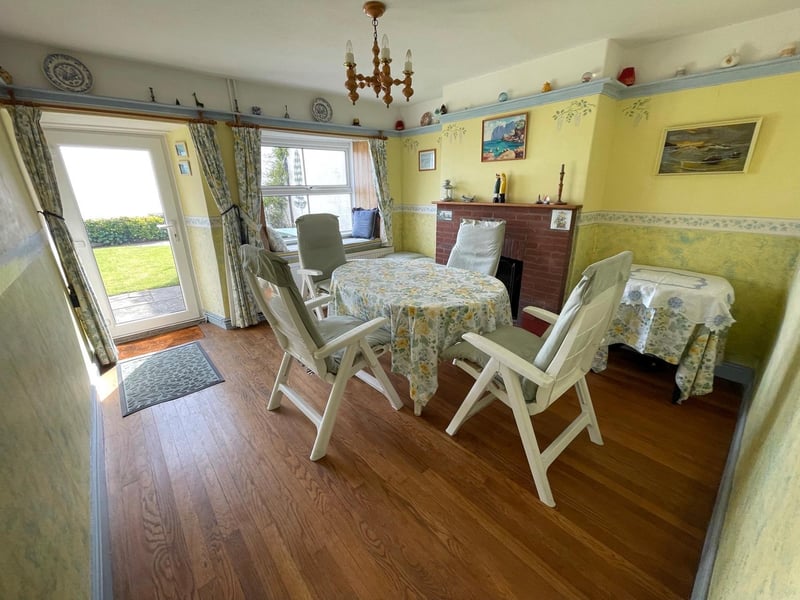 This bright and cheerful room has a window seat from which to enjoy the view