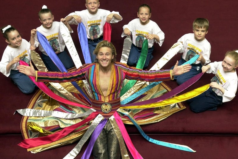 Glen Drake pictured with with children from Heckmondike-based Young Showstoppers at the Grand Theatre where he was starring in Joseph and the Amazing Technicolor Dreamcoat.