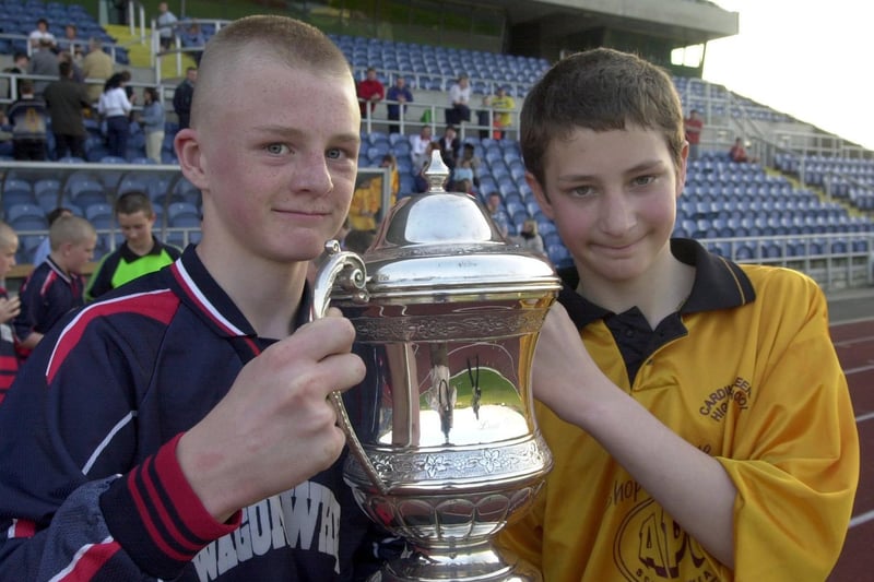 Crawshaw School and Cardinal Heenan shared the U-13 Don Revie Trophy after the final finished 1-1 at South Leeds Stadium. Pictured are captain's Daniel Matthew of Crawshaw (left) and Adam Pudelko.