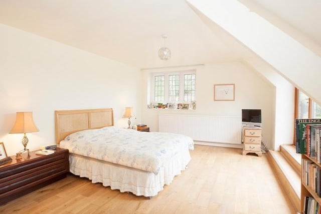 Upstairs there are three bedrooms all with stunning views and fitted wardrobes. The master bedroom has a huge window and door overlooking the roof terrace, gardens and beyond. It has an archway through to its private dressing room and en-suite bathroom.