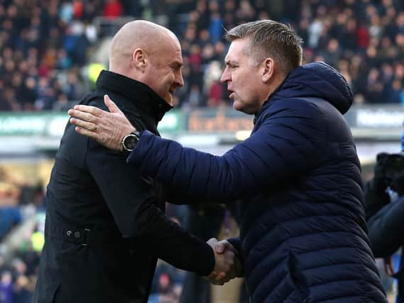Dean Smith, Manager of Aston Villa shakes hands with Sean Dyche of Burnley prior to the Premier League match between Burnley FC and Aston Villa at Turf Moor on January 01, 2020 in Burnley, United Kingdom.