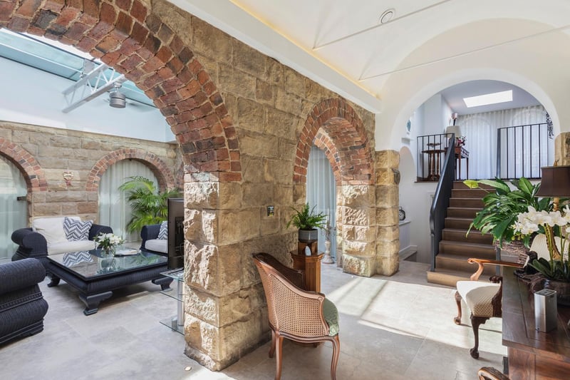 The owners have preserved original features, including these stone arches