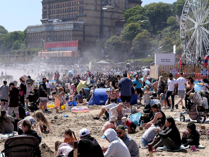 People pack on to the sand.
