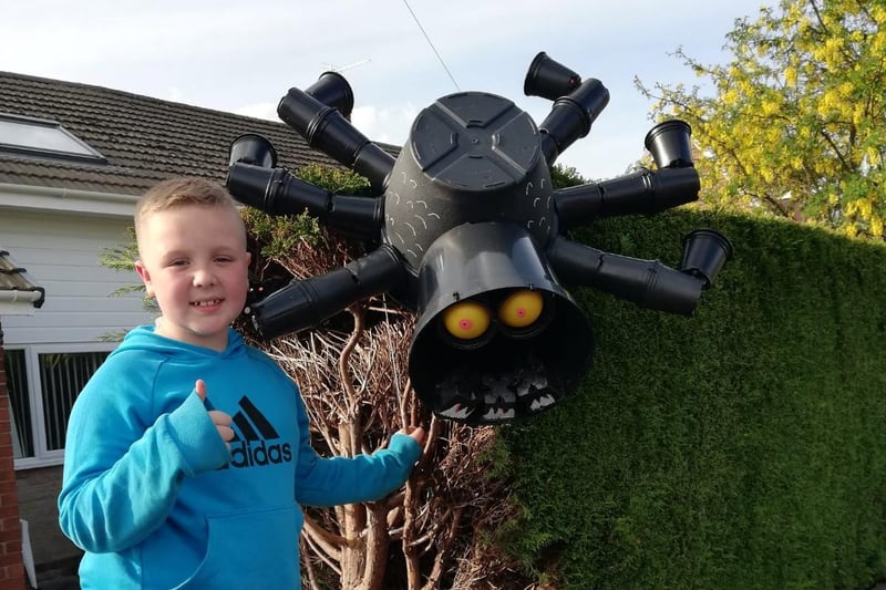 This creepy plant pot creation crawls down a hedge in the  Brindle Gregson Lane in Bloom Trail