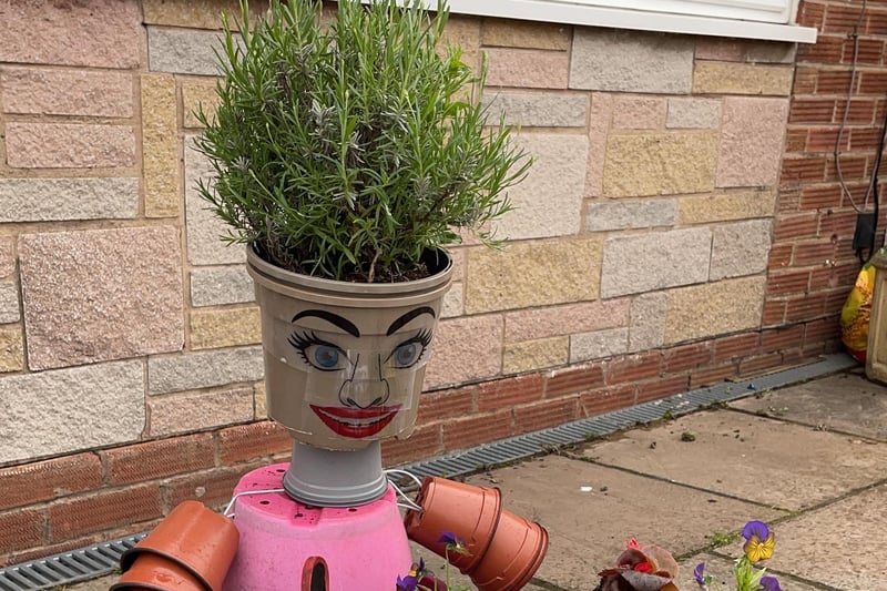 These plant pots have been transformed into a horse being taken for a trot in the  Brindle Gregson Lane in Bloom Trail