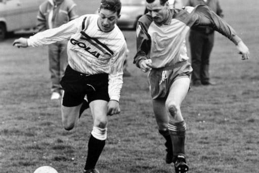 Neil Ward, left of Stanley United takes on Fieldhead defender David Turner in a Wakefield League match