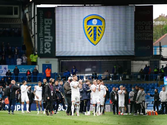 BACK WITH A BANG: Leeds United applaud their fans in the Elland Road stands after their season finale victory against West Brom. Photo by JON SUPER/POOL/AFP via Getty Images.