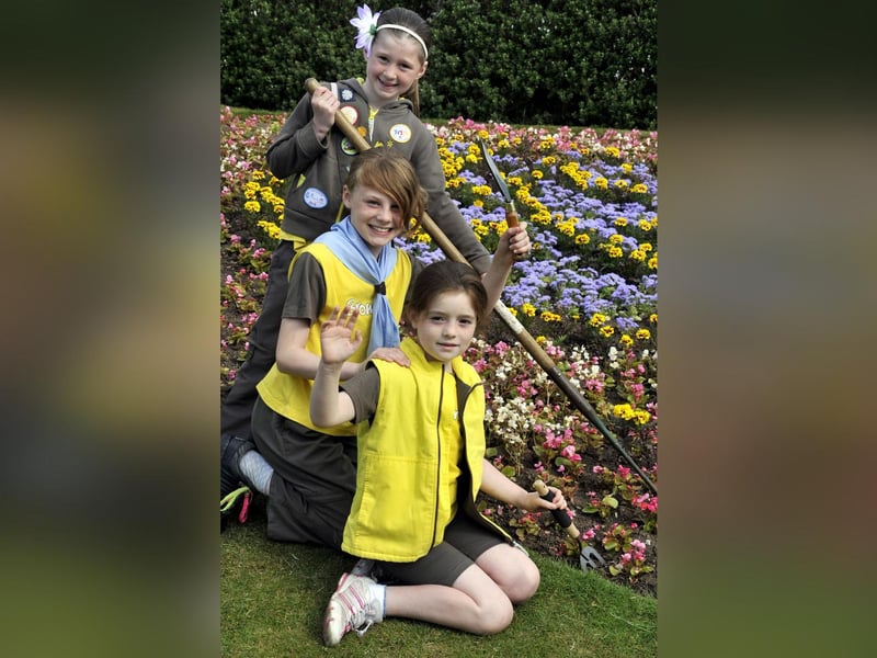 Girl Guides help create a flowerbed on Colombus Ravine to celebrate their centenary.
