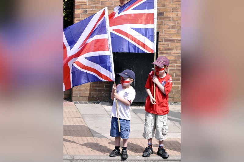 On Armed Forces Day in Scarborough two little lads get ready to cheer on the troops.