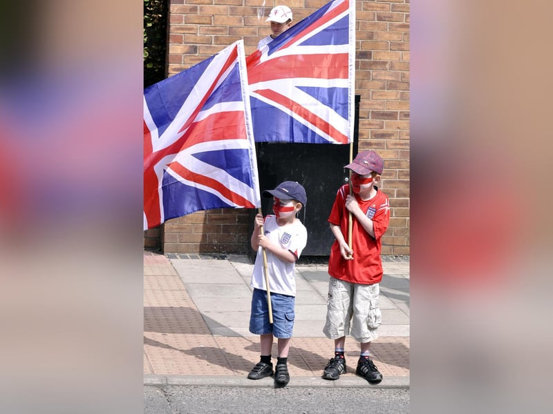 On Armed Forces Day in Scarborough two little lads get ready to cheer on the troops.