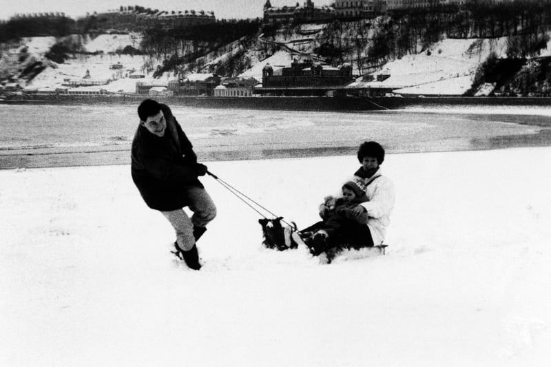 One thing that never changes is the unpredictable weather on the Yorkshire Coast - exemplified here by snow on South Bay enjoyed by David and Joy Wilcox, 3-year-old Elizabeth and their dog, Mitzy.