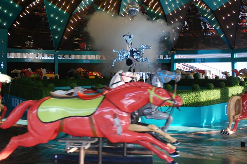 The Derby Racer is a huge carousel made up of 56 horses arranged in four rows. As the ride rotates the horses move up and down, simulating an action packed race.