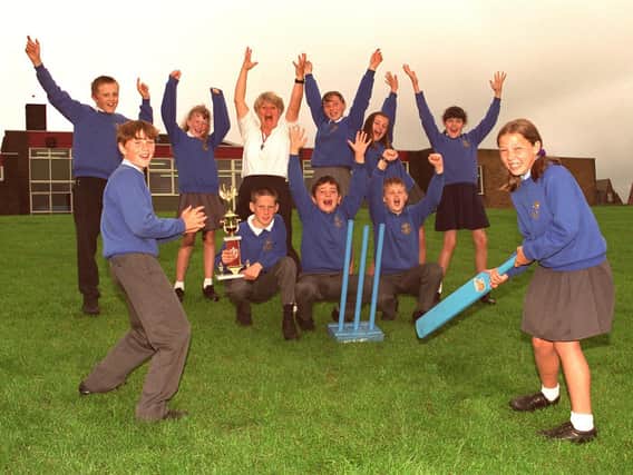 JUNE - 1997 - Howzat!  Kwik cricket kings St, Marie's RC Primary School, Standish, Year 6 pupils who have won the North of Wigan heat and now qualify for the Wigan tournament and further down the line a possible place in the finals at Old Trafford. Helping them celebrate is PE teacher, Linda Unsworth.