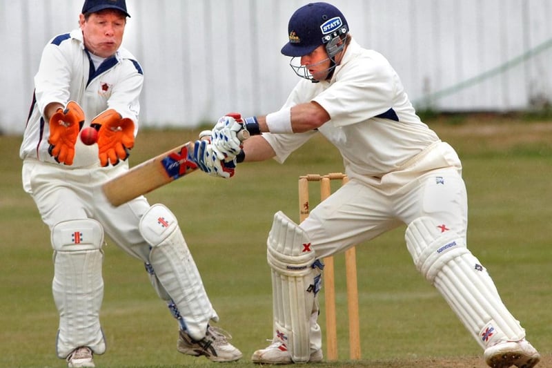 Wigan batsman Aaron Redmond is nearly caught by Orrell Red Triangle wicket keeper John Lawrence in a Liverpool and District Competition match on Saturday 29th of July 2006. The match was a draw.