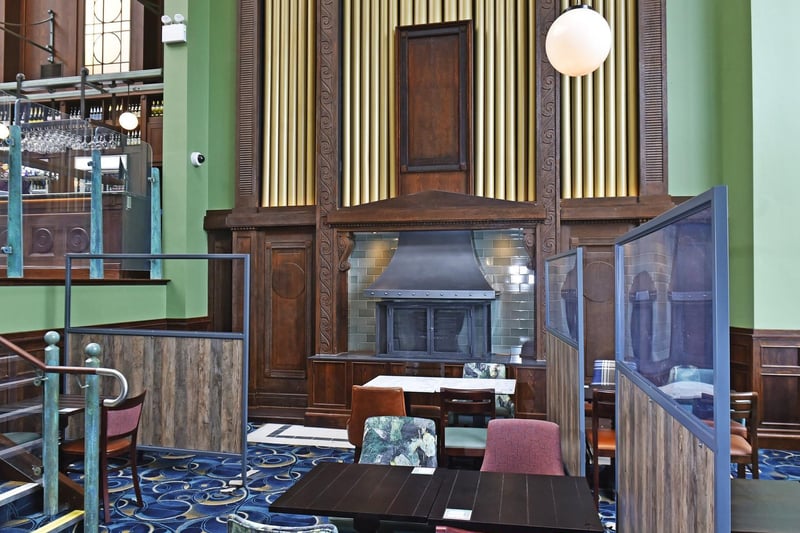 The pub has retained the original auditorium as the main ground floor bar area and the existing church organ facade has been repurposed as a feature fireplace.