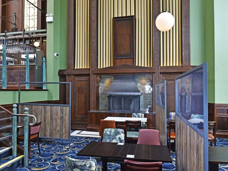 The pub has retained the original auditorium as the main ground floor bar area and the existing church organ facade has been repurposed as a feature fireplace.