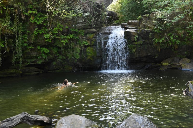 In the middle of beautiful woodland, this wild swimming spot in the heart of the moors near Beck Hole, sits under a waterfall. Steam trains pass nearby making this one of the more unusual places to take a dip.
