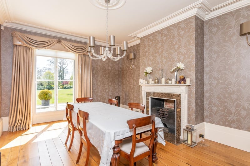 Also in the main wing of the house is the formal dining room which again overlooks the outstanding gardens, and benefits from a feature fireplace and high ceilings perfect for a bespoke chandelier.