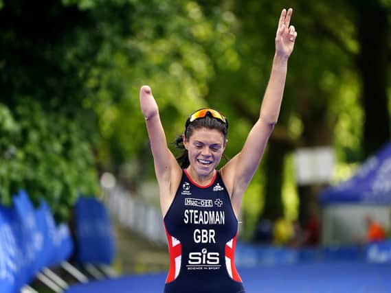 Lauren Steadman celebrates crossing the line during the AJ Bell 2021 World Triathlon Para Series race in Roundhay Park, Leeds. (photo: PA Wire/ Danny Lawson)