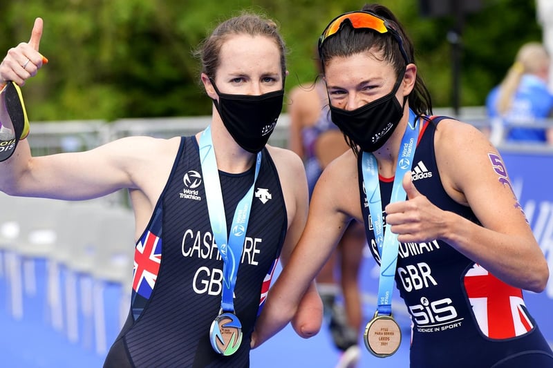 Lauren Steadman (right) celebrates winning gold in the PTS5 Women's event with Claire Cashmore winning silver during the AJ Bell 2021 World Triathlon Para Series race in Roundhay Park, Leeds (photo: PA Wire/ Danny Lawson)