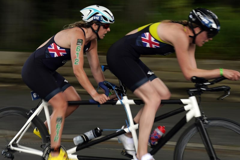 Melissa Reid (left) and guided during the cycling stage of the AJ Bell 2021 World Triathlon Para Series race in Roundhay Park, Leeds. (photo: PA Wire/ Danny Lawson)
