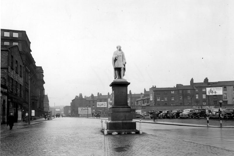 The statue of Henry R. Marsden pictured in  December 1949. On the left is E.G.S. Co. Ltd. electrical engineers and the City of Leeds School.