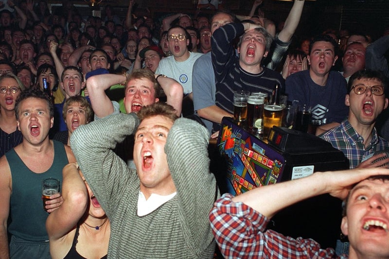 The moment England's Euro 96 dream ended as the Three Lions went out after a penalty shoot out against Germany. Pictured are football fans at Woodies in Headingley.