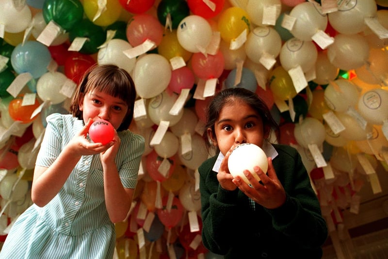 Whinmoor St Pauls RC Primary was planning a balloon release. Pictured are  Rachel Hall (left) and Hasmeet Matharu blowing up the last of 2,000 balloons.