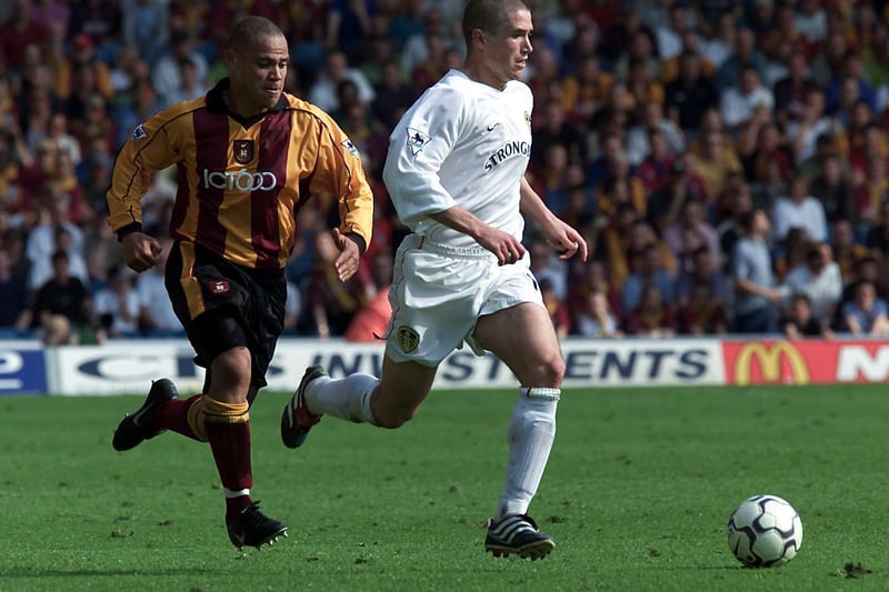 Harry Kewell powers past Bradford City's Andy Myers.