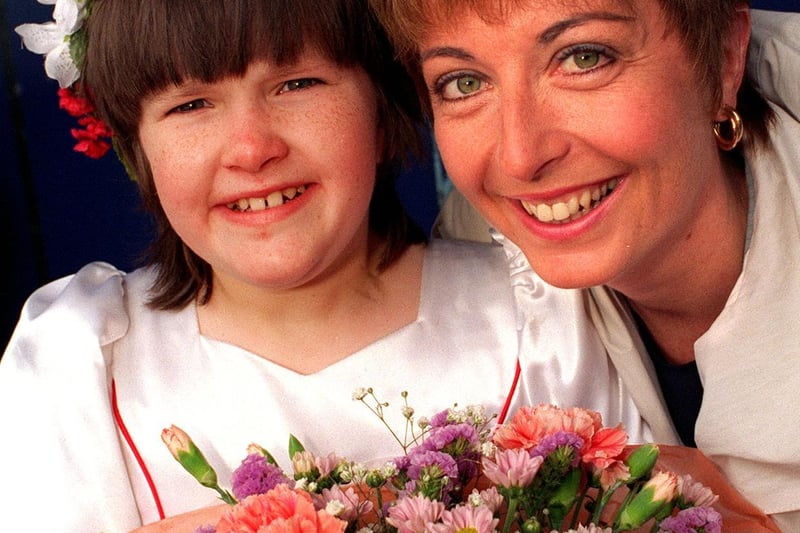 YTV Calendar presenter Gaynor Barnes is presented with a bouquet by Rebecca Bamford after she opened the Carnival in June 1997. Rebecca, a pupil at Green Meadows School, was an attendant to the Carnival Queen.