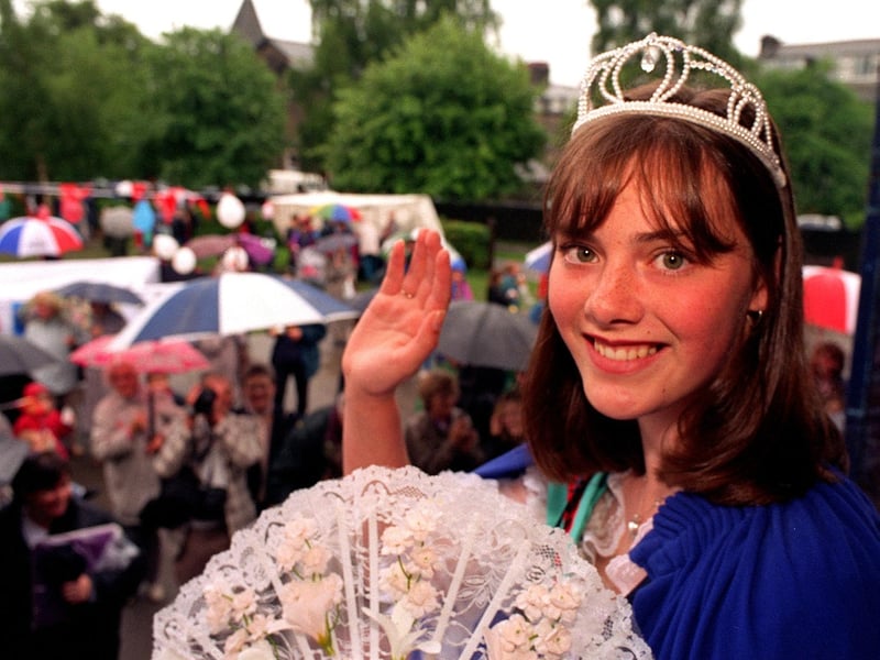 A happy smile in spite of the rain from Carnival Queen Gemma Hayton in June 1997. She was a pupil at Guiseley School.