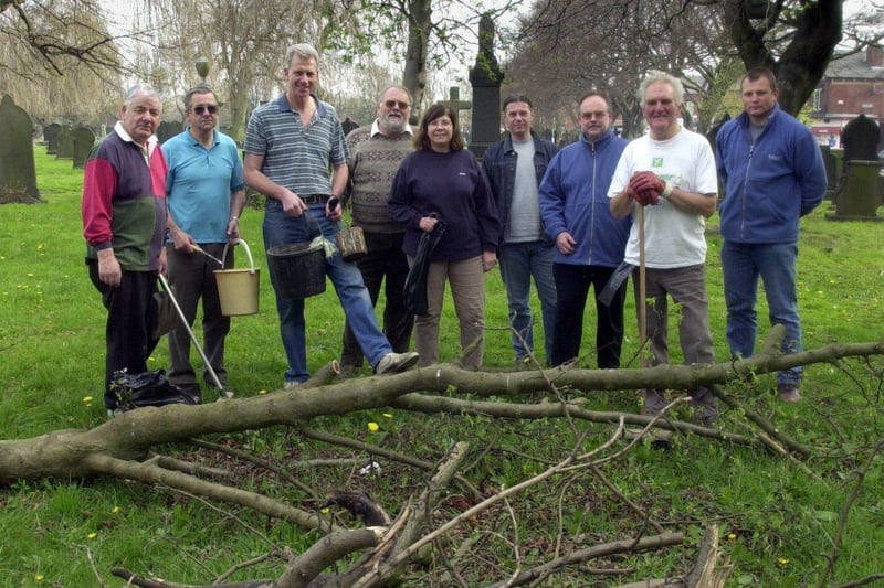 Friends of Beeston Cemetery and Holbeck Cemetery take a break from clearing up in the graveyard at St Mary's Church in April 2002.