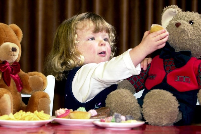 A teddy bears picnic was held to celebrate the launch of a new mums and tots group at City Evangelical Church on Cemetery Road in October 2002. Pictured is  Megan Ives feeding one of the teddies.
