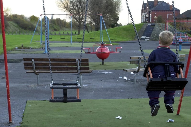 A child plays on the swings at the playground on Hunslet Moor Park which was  strewn with glass and rubbish. A campaign was launched aimed at tidying it up.