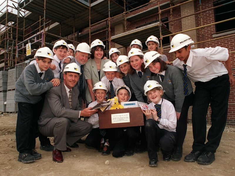 Pupils from Priesthorpe High School were burying a time capsule as part of a new extension. Pictured with pupils are Paul Willis, of Willmott Dixon Construction, Coun Mick Coulson and head of history Judith Hart.